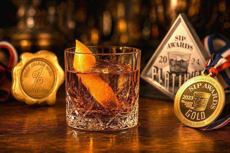 Still Branch award-winning Old Fashioned mix in a cocktail with award medals 