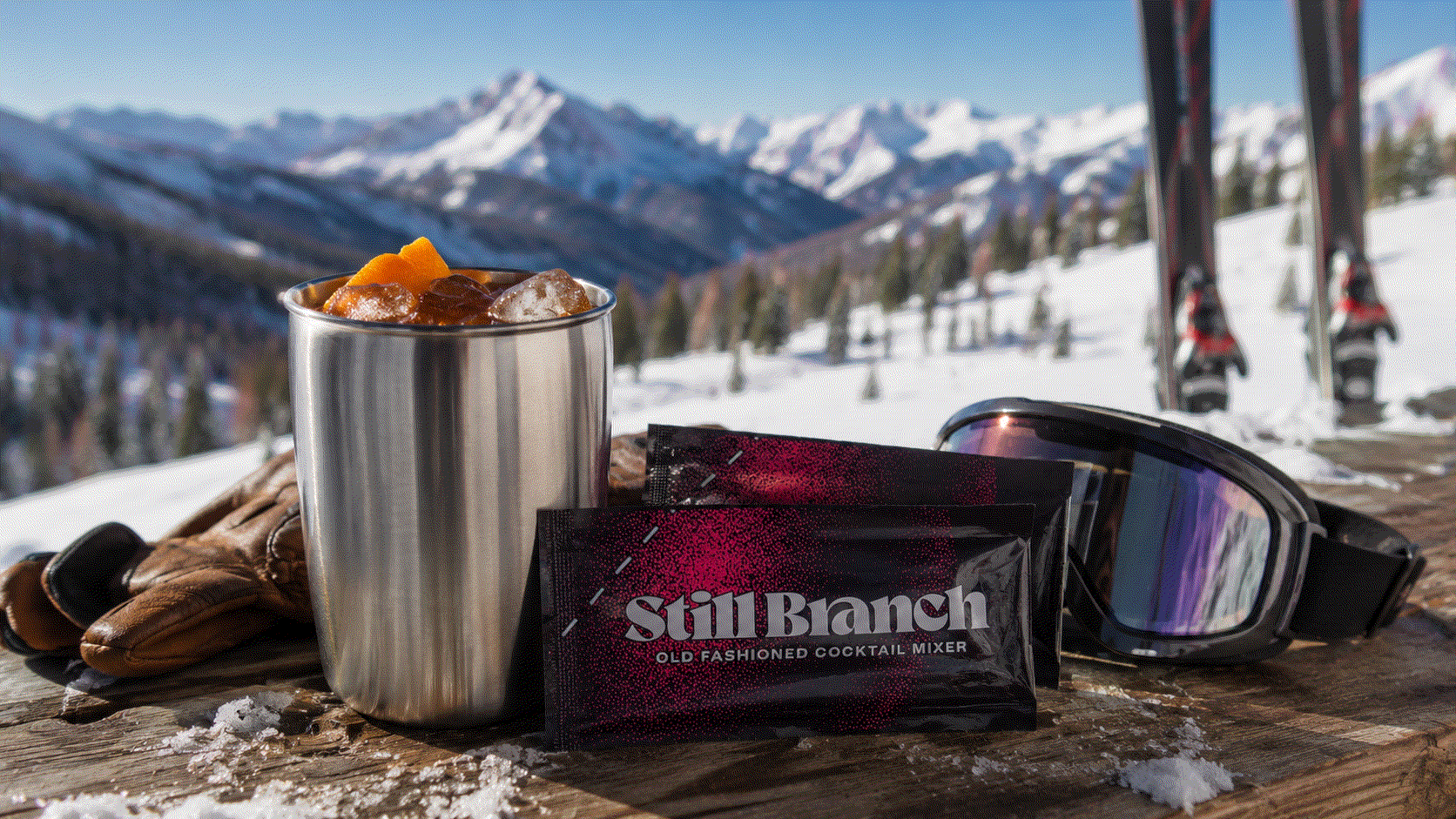 A travel Old Fashioned packet pulled from a ski jacket pocket at the top of a mountain