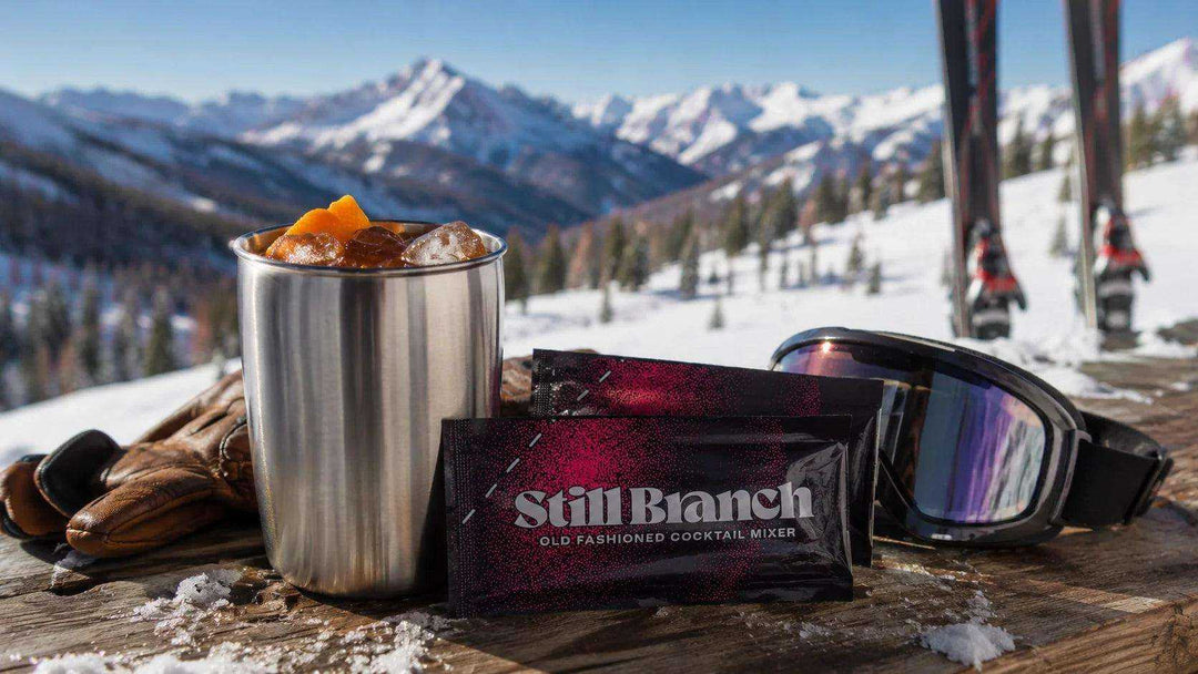 Still Branch travel Old Fashioned packet on a mountain with cocktail in a cup